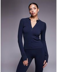 4505 - Seamless Sculpting Zip-up Long Sleeve Top - Lyst