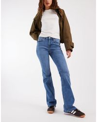 Vero Moda - Mid Rise Flare Jeans - Lyst