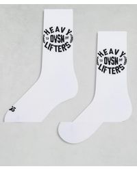 4505 - Confezione Da 2 Paia Di Calzini Da Allenamento Bianchi Con Grafica "Heavy Lifting" - Lyst