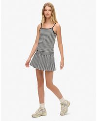 Superdry - Athletic essentials - jupe à rayures avec taille rabattue - bleu marine éclipse - Lyst