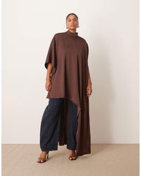 ARRANGE - Curve High Neck Cape Sleeve Mini Dress With Asymmetric Hem - Lyst