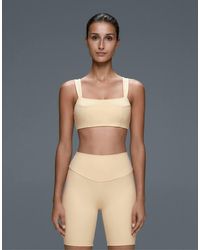 Oysho - Medium-support Comfortlux Sports Bra With Seams - Lyst