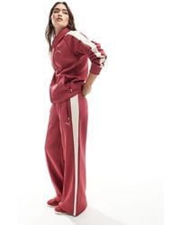 PUMA - Pantalones De Chándal De Talle Bajo T7 De (Parte De Un Conjunto)-Rojo - Lyst