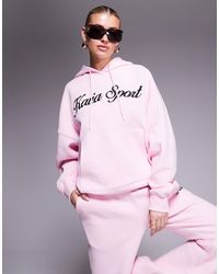 Kaiia - Sweat à capuche d'ensemble sport en coton mélangé avec logo script brodé - et noir - Lyst