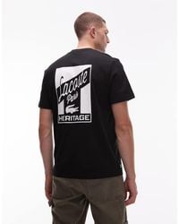 Lacoste - T-Shirt Nera Con Stampa Sul Retro - Lyst