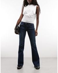 TRUE RELIGION - Joey Low-rise Flap Pocket Flare Jeans - Lyst