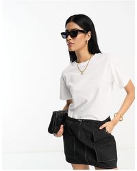 ASOS - Robe t-shirt 2 en 1 avec jupe cargo courte et coutures contrastantes - noir - Lyst