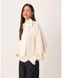 Pretty Lavish - Oversized Pussybow Bell Sleeve Blouse - Lyst
