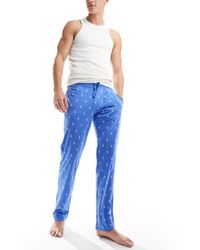 Polo Ralph Lauren - Joggers azul claro con estampado integral del logo - Lyst