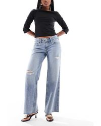 Hollister - Vaqueros Muy De Talle Bajo Y Corte Holgado Curvado Con Lavado Gris Tintado De - Lyst