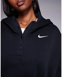 nike mini swoosh oversized cropped zip through hoodie in black