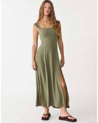 Stradivarius - Robe longue en lin mélangé avec liens croisés dans le dos - kaki - Lyst
