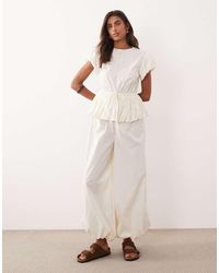 ASOS - Jumpsuit With Peplum And Balloon Legs - Lyst