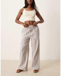 ASOS - Gestreepte Broek Met Linnenlook, Wijde Pijpen, Elastische Taille En Textuur - Lyst