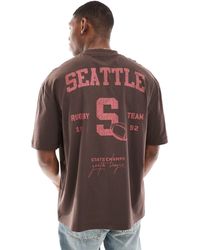 ASOS - Camiseta marrón oscuro extragrande con estampado deportivo "seattle" en la espalda - Lyst