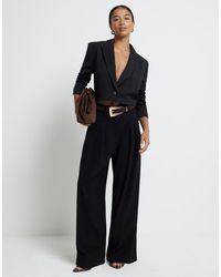River Island - Geplooide Broek Met Wijde Pijpen - Lyst