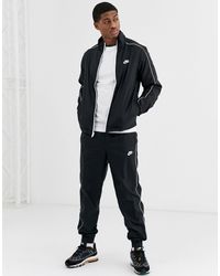 nike woven tracksuit set in beige