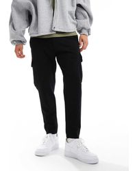 BOSS - Pantalones Cargo Negros Urbanex De - Lyst