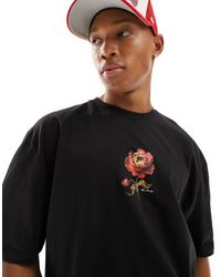 ASOS - T-shirt oversize nera con stampa di rosa sul petto - Lyst