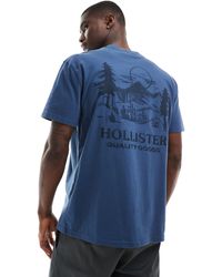 Hollister - Camiseta azul holgada con bordado y estampado en la espalda - Lyst