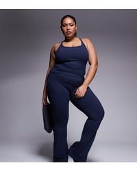 4505 - Curve Icon Yoga Cami With Inner Bra And Adjustable Straps - Lyst