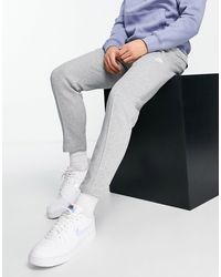 Nike Club Logo Tapered Fit joggers in Blue for Men | Lyst UK