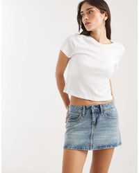 Hollister - Low Rise Five Pocket Mini Denim Skirt With Built - Lyst
