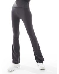 agon® - Flared Leggings - Lyst