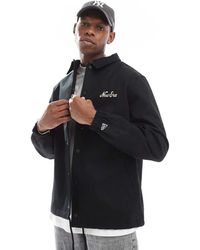 KTZ - Giacca Coach Nera Con Motivo Decorativo Sul Retro - Lyst