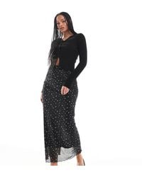 ONLY - Falda Larga Negra Con Estampado De Florecitas Y Bordes Ondulados De - Lyst