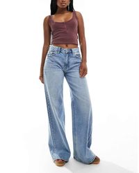 Bershka - Jeans Met Hoge Taille, Wijde Pijpen En Wassing - Lyst