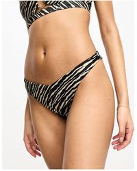 Hunkemöller - Hunkemöller - slip bikini sgambati marroni con stampa zebrata - Lyst