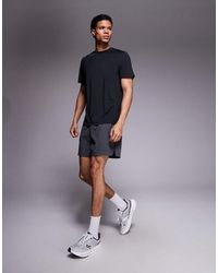 4505 - 5" Running Short With Elastic Waist And Zip Phone Pocket - Lyst