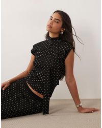 Pretty Lavish - Bonnie Knit High Neck Cap Sleeve Top - Lyst