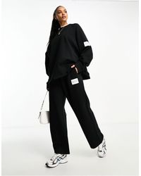 ASOS - Oversized Sweat With Woven Label - Lyst