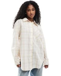 Monki - – oversize-hemdbluse aus baumwolle mit karomuster - Lyst