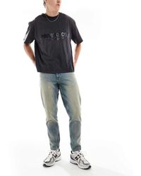 ASOS - Jeans Affusolati Lavaggio Chiaro Con Tinta - Lyst