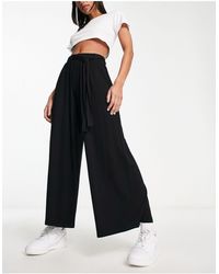 ASOS - Pantaloni culotte a fondo ampio neri con cintura annodata - Lyst