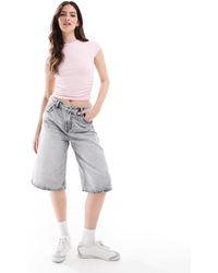 Stradivarius - Bermuda en jean - délavé - Lyst