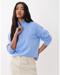 GANT - Sweat à logo écusson et demi-fermeture éclair - palace - Lyst