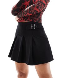 ASOS - Minifalda negra plisada con detalle - Lyst