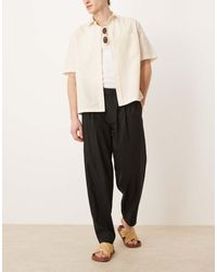 ASOS - Nette Oversized Toelopende Broek Van Linnenmix Met Plooi Aan De Voorkant - Lyst