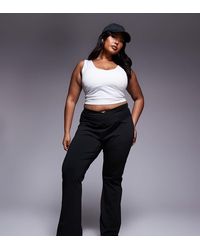 ASOS - Pantalones De Campana Negros Moldeadores De Talle Alto Con Cinturilla Cruzada De Asos Design Curve - Lyst