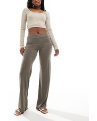 Monki - Broek Van Superzachte Jersey Met Lage Taille En Wijde Pijpen - Lyst