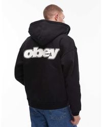Obey - Sudadera Negra Extragrande Con Capucha, Cremallera Y Estampado En La Espalda De Tejido Grueso Gaze De - Lyst