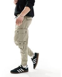 Bershka - Pantalon cargo technique à poches - écru - Lyst