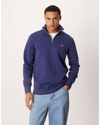 GANT - Sweat à logo écusson et demi-fermeture éclair - Lyst