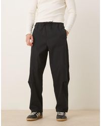 ASOS - Pantalones Negros Holgados Sin Cierres De Corte Tapered De - Lyst