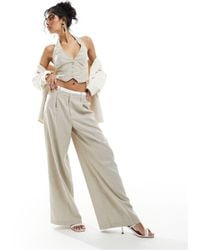 Bershka - Pantaloni sartoriali a fondo ampio beige chiaro con vita stile boxer - Lyst