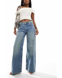 Bershka - Jeans A Fondo Ampio E Vita Alta Lavaggio Medio Sporco - Lyst